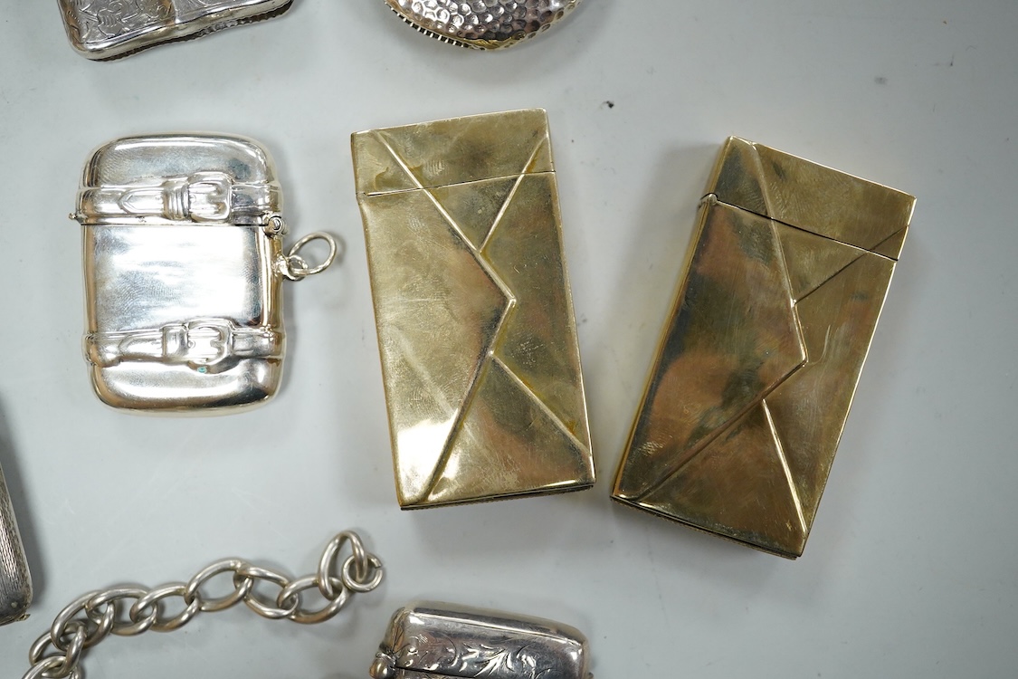 Three assorted silver vesta cases including one with a white metal chain, two gilded 900 standard white metal vesta cases, designed as a letter with postage stamp, 60mm, one 925 vesta case modelled as a satchel and two s